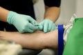 Details with the hands of a doctor preparing to take blood from the vein of a patient with a catheter Royalty Free Stock Photo