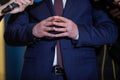 Details with the hands of a politician during a press conference