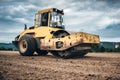 Details of highway construction site - industrial machinery, vibratory soil compactor working Royalty Free Stock Photo