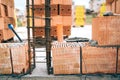 House building, brick walls and steel infrastructure. Construction site