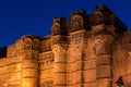Details of Jodhpur fort illuminated at twilight. The majestic fort perched on top dominating the blue town. Scenic travel destina