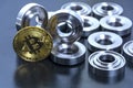 Details machined on a lathe and bitcoin on a black background. The concept of real and virtual income, earnings on the Internet