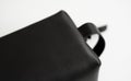 Details of man's black leather personal cosmetic bag or pouch for toiletry accessory. Style, retro, fashion, vintage Royalty Free Stock Photo