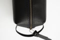 Details of man's black leather personal cosmetic bag or pouch for toiletry accessory. Style, retro, fashion, vintage Royalty Free Stock Photo