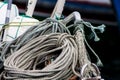 Maritime ropes over fishing boat moored Royalty Free Stock Photo