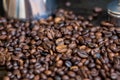 Details of a metal coffee maker in coffee beans Royalty Free Stock Photo