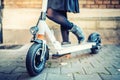 Details of modern transportation, electric kick scooter, Portrait of girl riding the city transportation