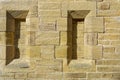 Details of the narrow stone framed windows blocked off within the end wall of the North Chapel at Ilkley Cemetery