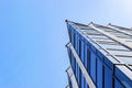 Details of office building exterior. Business buildings skyline looking up with blue sky. Modern architecture apartment. High tech Royalty Free Stock Photo