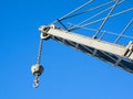 Details of an old crane: hook, chain, pulley, beam, rivets