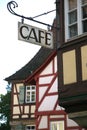 Details of old half-timbered houses with a cafe sign