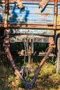 Details of an old and rusty tractor trailer, abandoned trailer of a tractor in a village