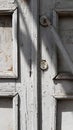 Rough texture of old wooden door. Entrance to shabby door of abandoned building Royalty Free Stock Photo