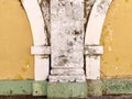 Old yellow white and green painted building exterior Royalty Free Stock Photo