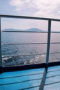 Details of passenger boat. Cruise ship deck. Picturesque view from ship deck on navy blue sea, horizon and sky during vacation. Royalty Free Stock Photo
