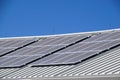 Details of photovoltaic solar power generation panels on the roof top against a clear blue summer sky in Arizona Royalty Free Stock Photo