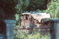 Details of a pile of stacked clay bricks with holes in a courtyard in a rural area