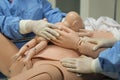 Details with plastic dummies representing a woman and her newly born baby used by medics and midwives for childbirth practice