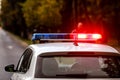 Details with the red and blue lights siren on top of a police car Royalty Free Stock Photo