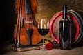 Red wine in glass, barell and violin Royalty Free Stock Photo