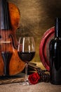 Red wine in glass, barell and violin Royalty Free Stock Photo