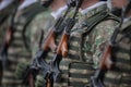 Details with a Romanian army soldier holding an AK 47 assault rifle during a military ceremony at the Monument of the Unknown