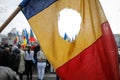 Details with the Romanian flag with a hole, the symbol of the Romanian Revolution from December 1989