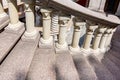 Details of a round spiral staircase with stone steps.