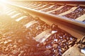 Details snowy Russian winter railway under bright sunlight. The rails and sleepers under the December snow. Russian Railways in d