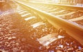 Details snowy Russian winter railway under bright sunlight. The rails and sleepers under the December snow. Russian Railways in d