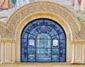 Details of stone carving and stained glass window Royalty Free Stock Photo