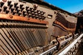 Details of strings and keys Inside of a broken wooden piano, in Arizona Royalty Free Stock Photo