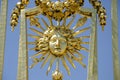 Details of the sun symbol in golden exterior fence at the facade of the palace, Versailles, France Royalty Free Stock Photo