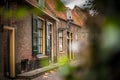 View on traditional Dutch houses and streets in a recreated heritage museum with beautiful historic vintage scenes from Holland.