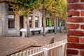 View on traditional Dutch houses and streets in a recreated heritage museum with beautiful historic vintage scenes from Holland.