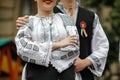 Details with the traditional Romanian clothing of a young woman and man