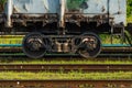 Details of the train in close-up. Railway. Locomotive wheels and springs. Repair train Royalty Free Stock Photo