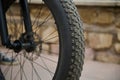 Details on tubeless tire of an electric motor bike, mountain bike. Shallow tread of a bicycle tubeless tire. Cropped