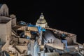 Details of typical buildings illuminated at night in Fira, the main town of Santorini, Greece Royalty Free Stock Photo