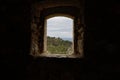 Details with the view from a window inside a mediaeval fortress on the French riviera during a cloudy spring day