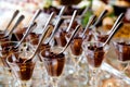 Details from a wedding dessert table - chocolate mousse in fancy glasses with spoons Royalty Free Stock Photo