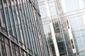 Details with the windows and glass walls and reflections in them of an office/business modern building Royalty Free Stock Photo