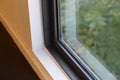 Details of windows temperature glass with matte black aluminum frame.