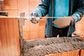 Details of worker hands, putty knife, spatula and brick mortar