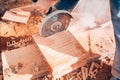 Details of worker using angle grinder for cutting bricks on construction site Royalty Free Stock Photo