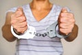 Detained woman at the police station. Handcuffs on the wrists of the detainee. Royalty Free Stock Photo