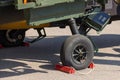 Detail of a landing gear with aircraft thrust pad of combat helicopter on apron