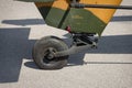 Detail of a landing gear and chassis of a parked combat helicopter on apron