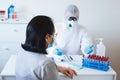 Detection of coronavirus concept. Doctor examines patient suspected coronavirus infection wearing protective equipment