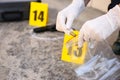 Detective collecting evidences at crime scene, closeup Royalty Free Stock Photo